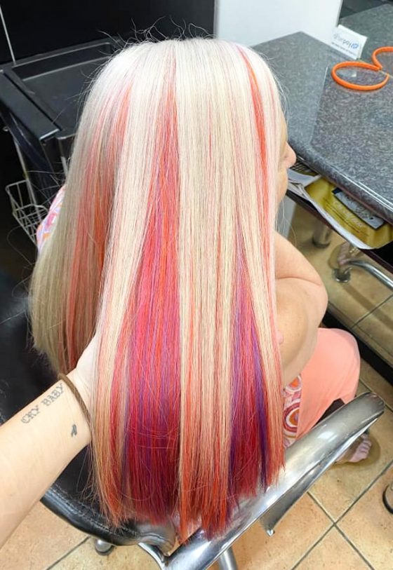 A Blonde Hair with Bight Red Colour Under — Hair Salon in Darwin, NT